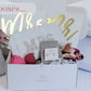 A bridal gift box with a Mrs. make up bag, luxury make up brushes, pearl earrings, and make up accessories
