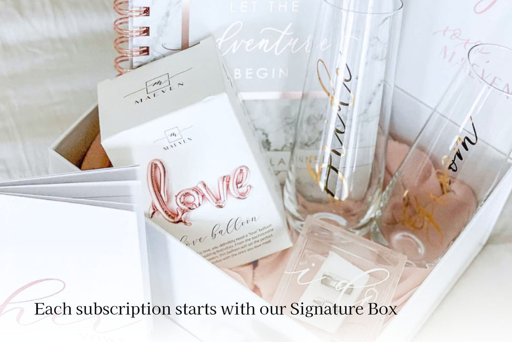 Maeven Signature Box with bride and groom champagne flutes, his and her vow books, wedding planner, ring box, and love balloon